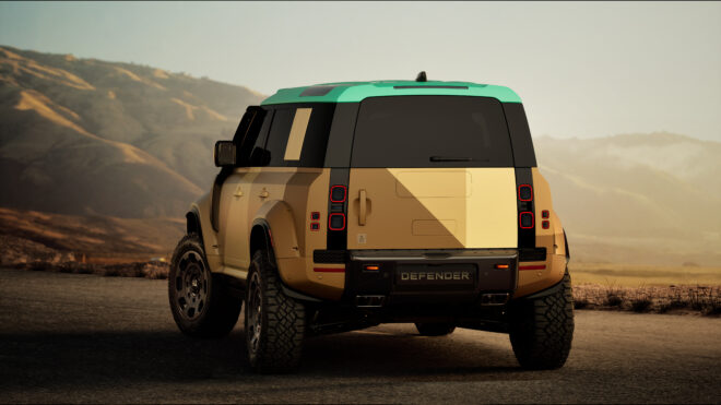 Defender Dakar in Dakar Sand mit türkisfarbenem Dach von hinten vor einer Berglandschaft